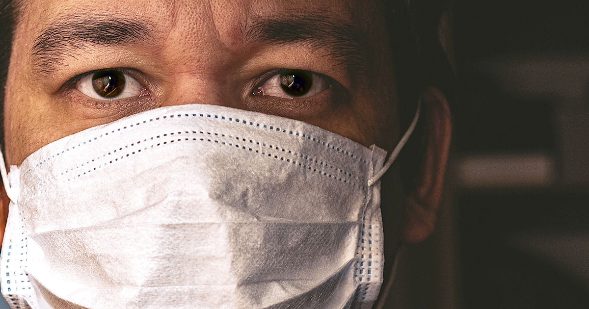 Closeup of man in mask, concept of viral infection. Theme of corona-virus epidemic.