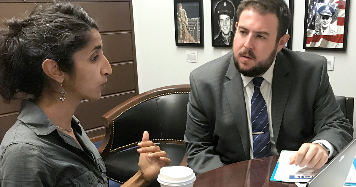 Aparna Keshaviah meets with a legislative aid about an online dashboard developed by Mathematica that focuses on health risks posed to women of child-bearing age who misuse opioids.