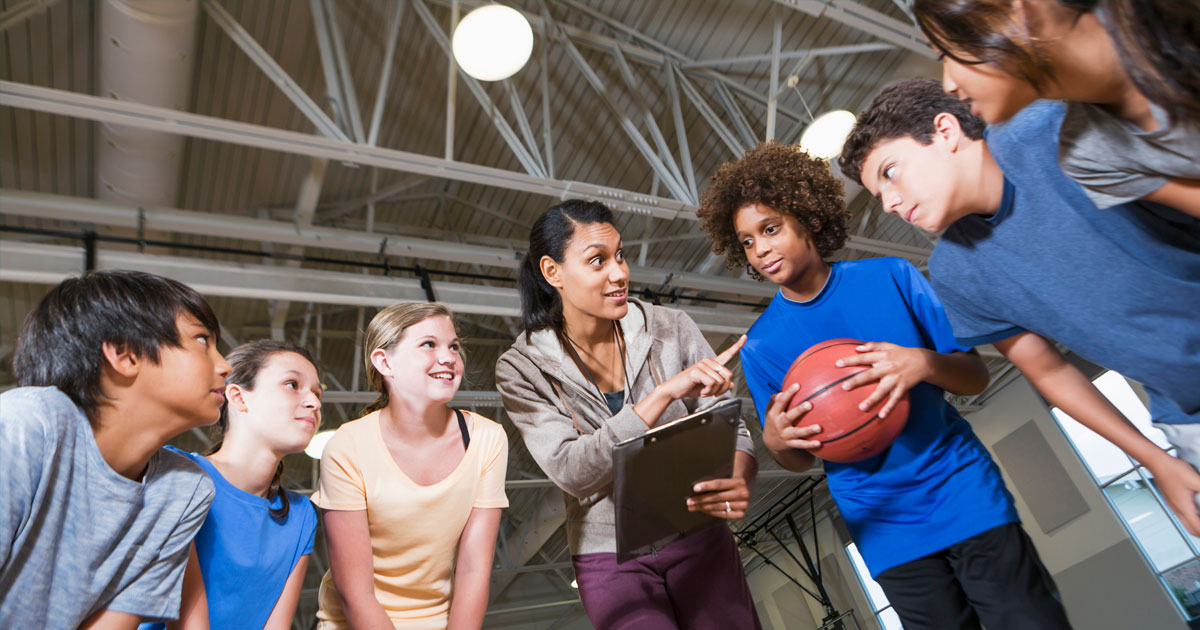 a group of teens with coach