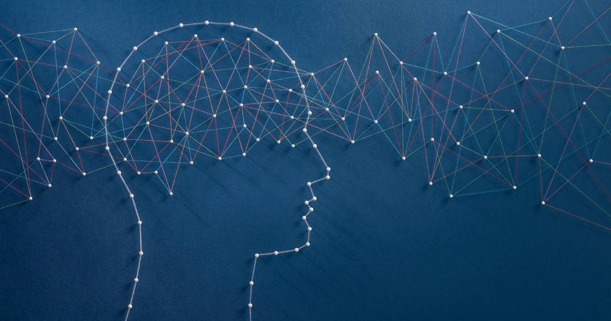 Illustration of a person's silhouette with graph lines through the head