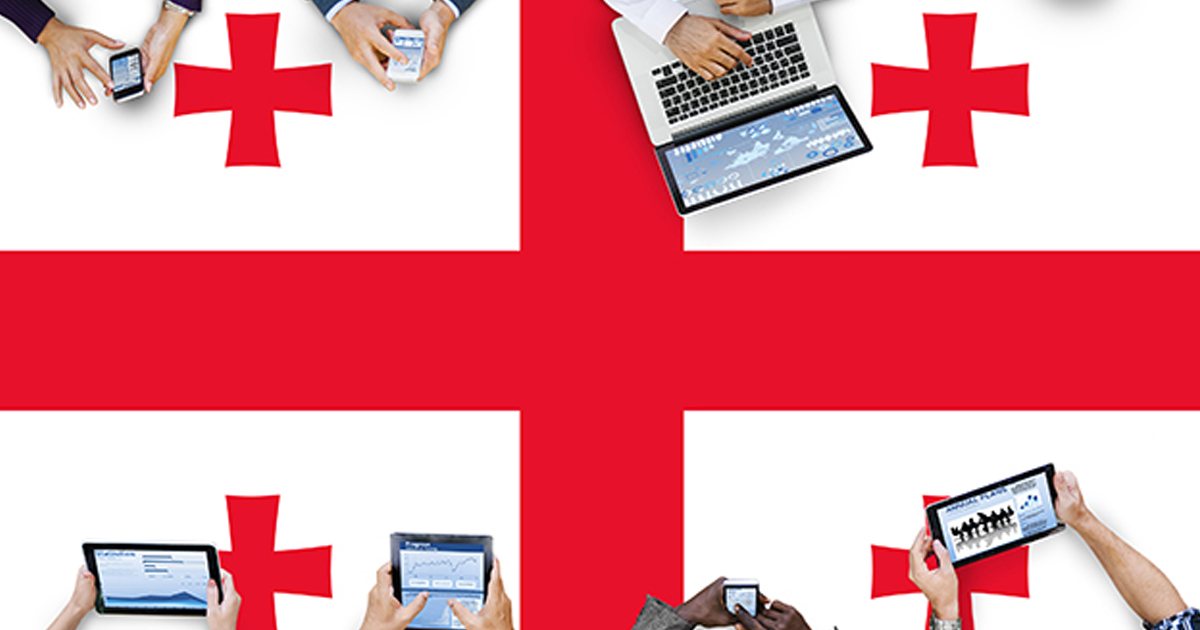 Georgia flag with people using computers