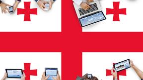 Georgia flag with people using computers
